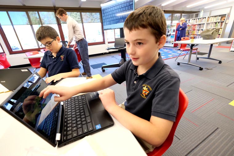 Holy Cross School rolls out new library/media center