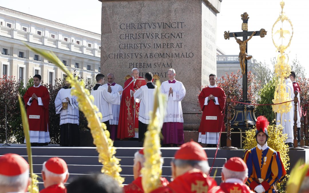 Love Jesus in all who suffer, pope says on Palm Sunday