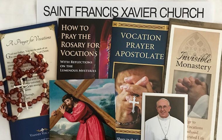 Deacon Falge preps prayer packets for vocations