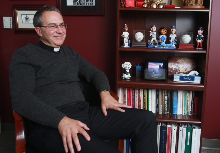 Brewers chaplain finds joy in connecting his love of priesthood, sports