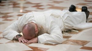 Father Brooks prostrates himself during the Litany of Supplication