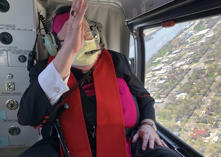Bishop says praying over diocese from helicopter may give comfort