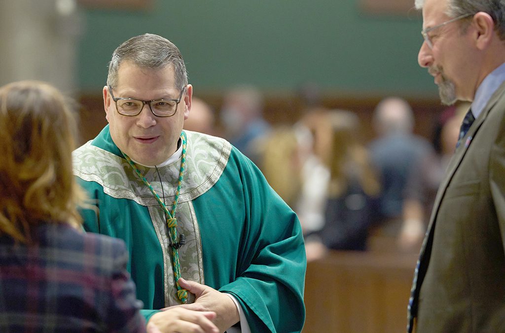 Catholic Charities centennial celebration reaches its peak with Mass, reception