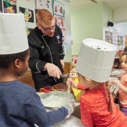 Chef Scott Ferguson supervises an activity on Career Day for three- and four-year-olds Feb. 2 at Blessed Sacrament School in Syracuse. - Sun PHOTO | CHUCK WAINWRIGHT