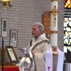 Our Lady of Lourdes Pastor Father Joseph Salerno concelebrates the parish's 100th anniversary Mass May 5, 2019. (Sun photo | Katherine Long)